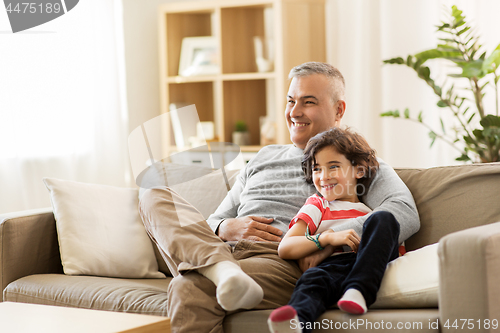 Image of happy father with little son at home