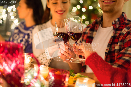 Image of close up of friends with wine celebrate christmas