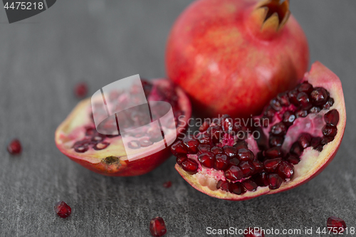 Image of close up of pomegranate on stone table