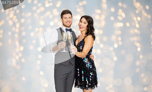 Image of happy couple with champagne glasses at party