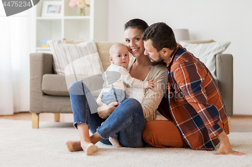 Image of happy family with baby having fun at home