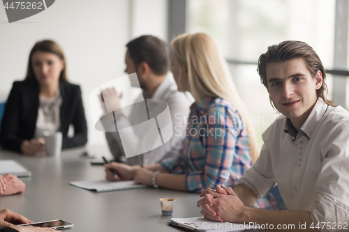 Image of Group of young people meeting in startup office