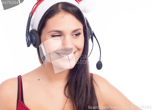 Image of Christmas headset woman from telemarketing call center wearing red santa hat talking smiling isolated on white background.