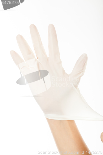 Image of put a latex glove