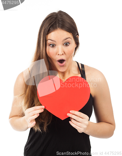 Image of young woman in love with a heart in hand
