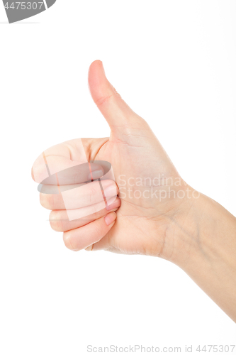 Image of Woman giving thumb-up for showing success. Woman\'s right hand is nice idea.