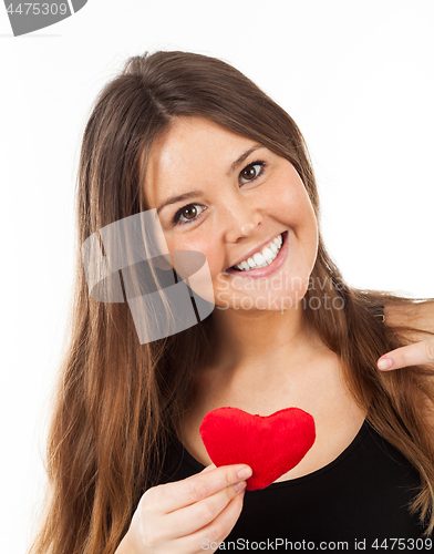 Image of young woman in love with a heart in hand