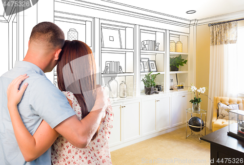 Image of Young Military Couple Facing Custom Built-in Shelves and Cabinet