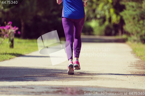 Image of young female runner training for marathon