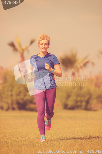 Image of young female runner training for marathon