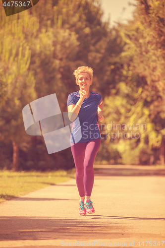 Image of young female runner training for marathon