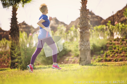 Image of young female runner training for marathon