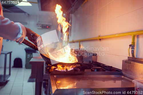 Image of Chef doing flambe on food