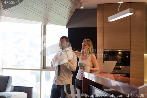 Image of A young couple is preparing for a job and using a laptop