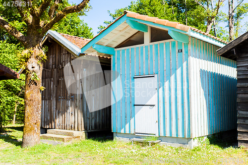 Image of typique colored wooden houses in biganos port in the Bay of Arcachon