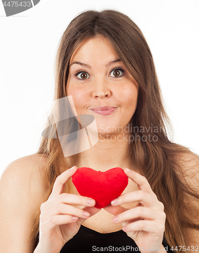 Image of young woman in love with a heart in hand