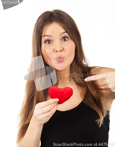 Image of young woman in love with a heart in hand