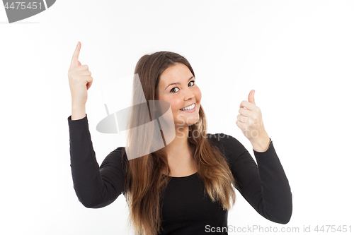 Image of Beautiful young woman showing blank signboard
