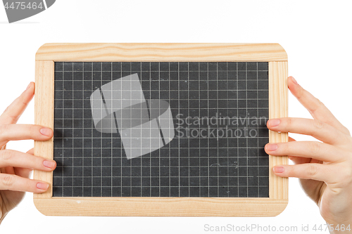 Image of woman\'s hands holding a blackboard publicity
