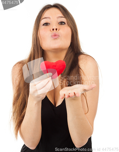 Image of young woman in love with a heart in hand
