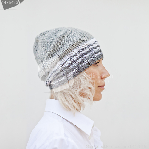 Image of Beautiful young woman in warm grey beanie.