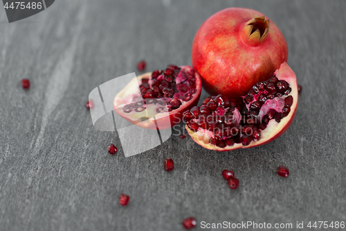 Image of close up of pomegranate on stone table