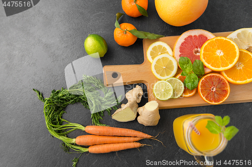 Image of fruits, vegetables, cutting board and juice