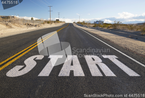 Image of close up of word start on suburban asphalt road