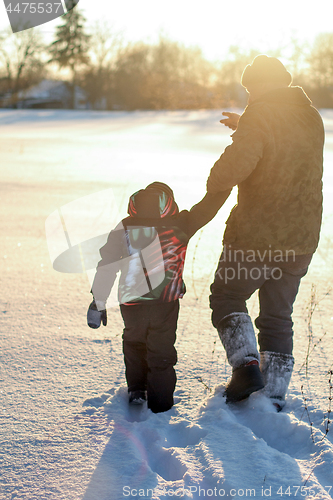 Image of Happy boy grandpa have winter fun