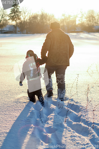 Image of Happy boy grandpa have winter fun