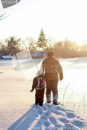 Image of Happy boy grandpa have winter fun