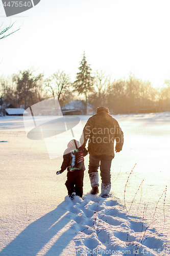 Image of Happy boy grandpa have winter fun