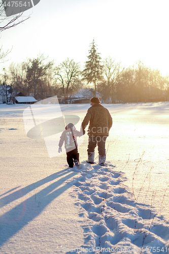 Image of Happy boy grandpa have winter fun