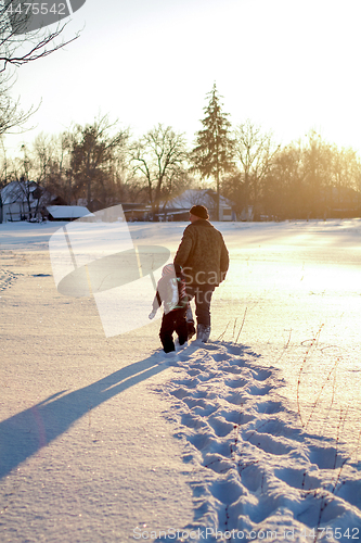 Image of Happy boy grandpa have winter fun