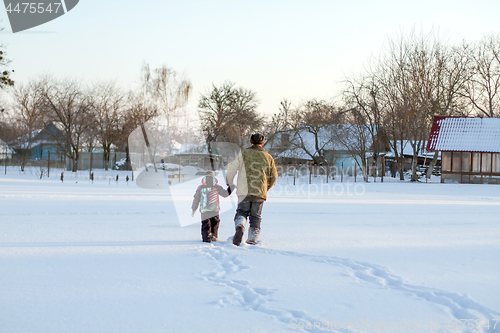 Image of Happy boy grandpa have winter fun