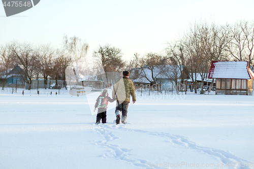 Image of Happy boy grandpa have winter fun