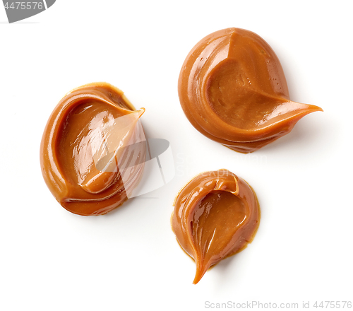 Image of melted caramel on a white background