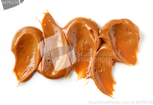 Image of melted caramel on a white background