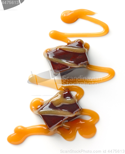 Image of chocolate candies and caramel sauce