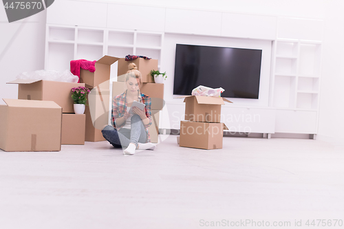 Image of young couple moving  in new house