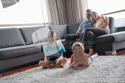 Image of couple spending time with kids