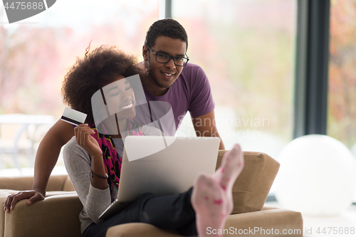 Image of african american couple shopping online