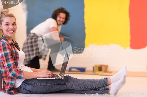 Image of Happy couple doing home renovations