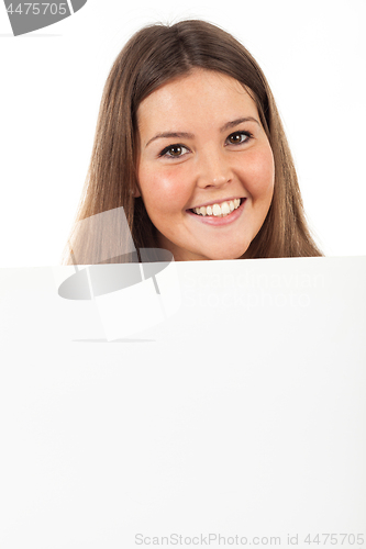 Image of Beautiful young woman showing blank signboard