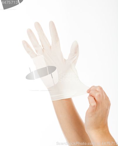 Image of put a latex glove