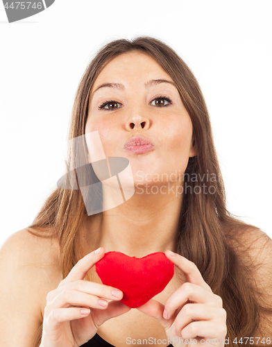 Image of young woman in love with a heart in hand
