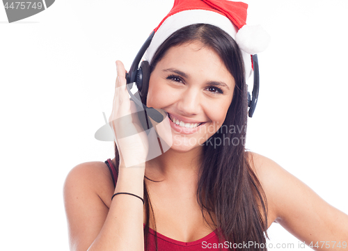 Image of Christmas headset woman from telemarketing call center wearing red santa hat talking smiling isolated on white background.