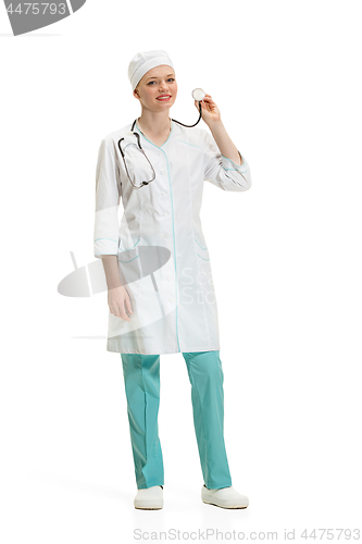Image of Beautiful young woman in white coat posing at studio. Full length studio shot isolated on white.