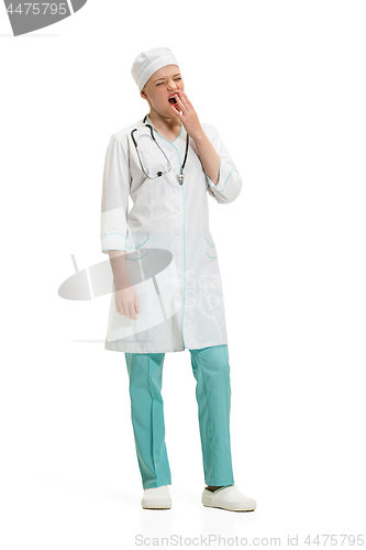 Image of Beautiful young woman in white coat posing at studio. Full length studio shot isolated on white.
