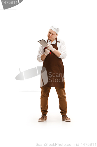 Image of Bored butcher posing with a cleaver isolated on white background